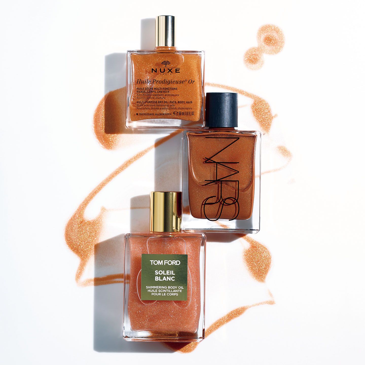 上から/ブルーベル ニュクス プロディジュー ゴールド オイル 50ml ¥4,200 、NARS モノイボディーグローⅠ 75ml ¥6,900、トム フォード ビューティ ソレイユ ブラン シマリングボディ オイル 02 100ml ¥12,000