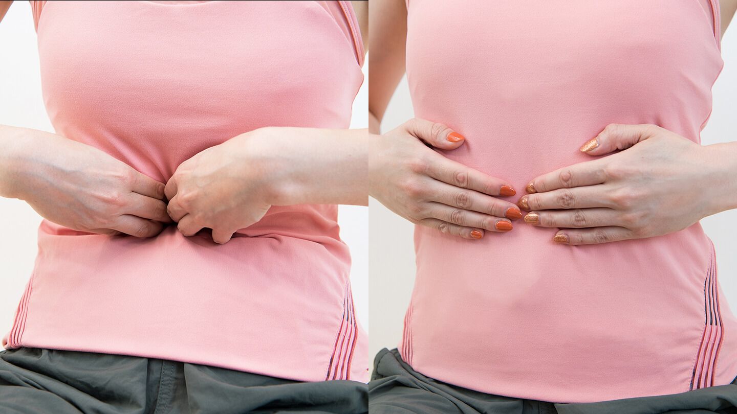 腹部をプッシュしている女性
