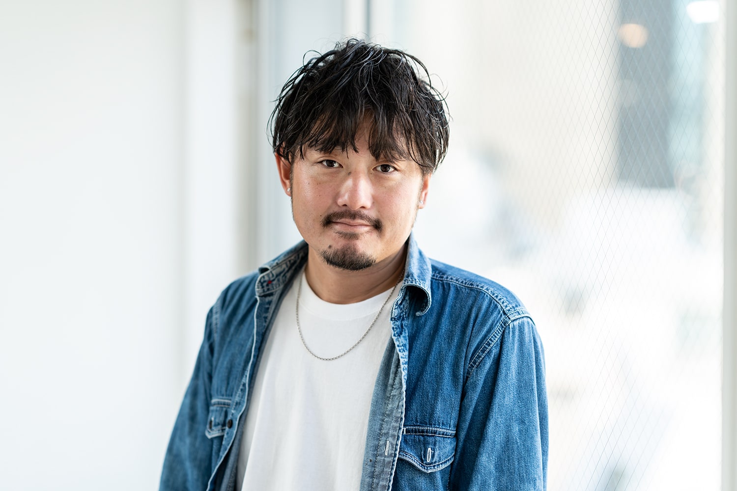 DIFINO akasaka 副店長・根本将平さん。趣味の1つがサーフィン。「子どもが生まれてから、なかなか時間がとれなくて。今は仕事と育児に奮闘中です」