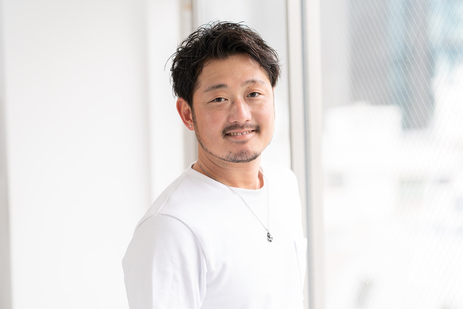 DIFINO akasaka 副店長・根本将平さん。この春から、趣味のサーフィンを再開。「子どもが生まれ、1年も海から遠ざかっていました。月2回は行きたいですね」